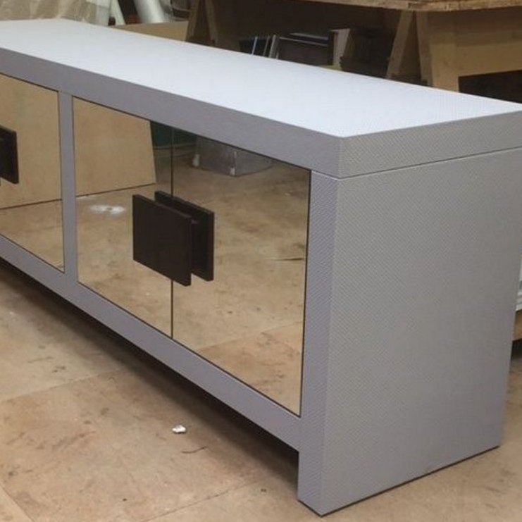 Sideboard unit in grey faux leather covering and mirrored doors